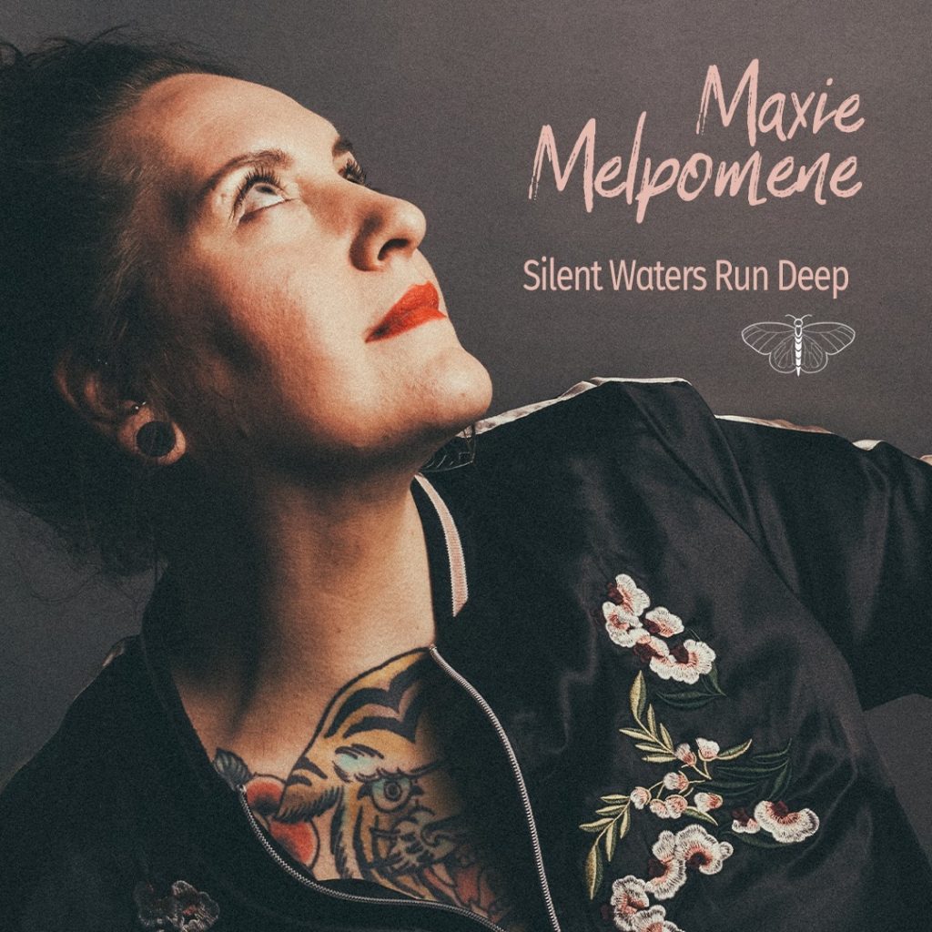 “Silent Waters Run Deep: Maxie Melpomene’s Haunting Journey Through Familial Bonds And Emotional Inheritance